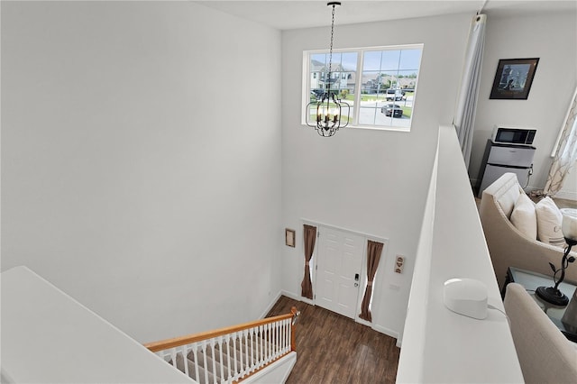 1940 Bell Creek Loop, Fruitland Park, FL 34731 - stairway with a chandelier, wood finished floors, and baseboards