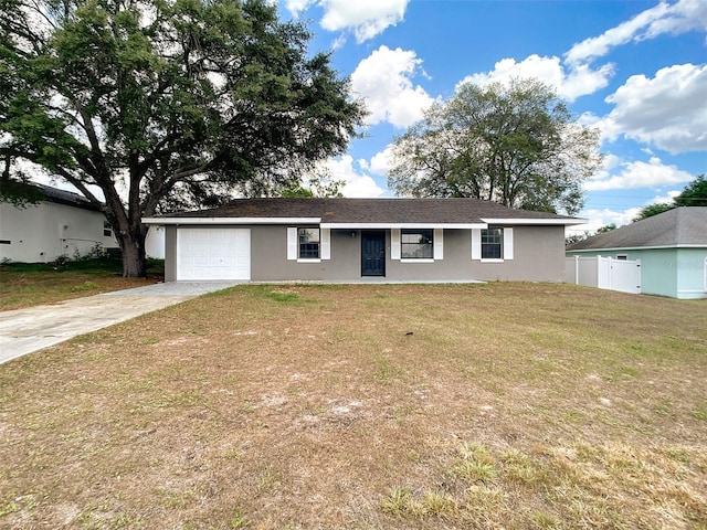 ranch-style house featuring fence, a garage, stucco siding, concrete driveway, and a front lawn