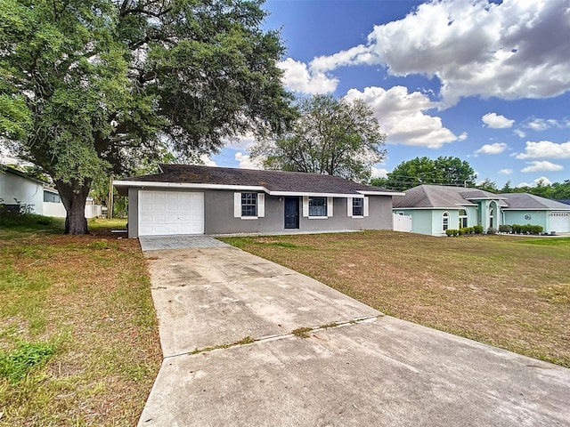 ranch-style home featuring concrete driveway, stucco siding, a front lawn, and an attached garage