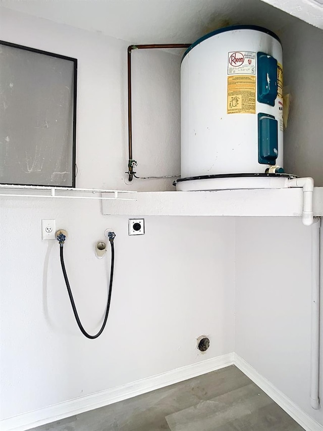 clothes washing area featuring washer hookup, laundry area, hookup for an electric dryer, water heater, and baseboards