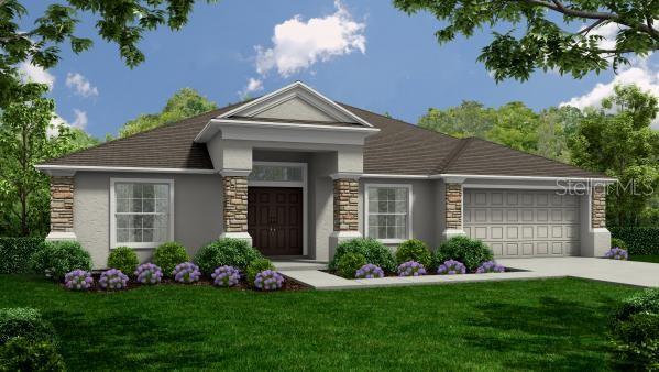 view of front of home featuring stucco siding, stone siding, a garage, and a front lawn