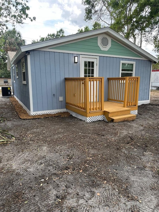 2217 Azalea Ct, Lakeland, FL 33815 - rear view of house featuring cooling unit and a deck