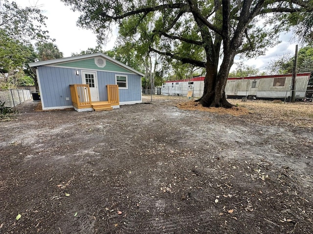 2217 Azalea Ct, Lakeland, FL 33815 - back of property with fence, board and batten siding, and an outbuilding