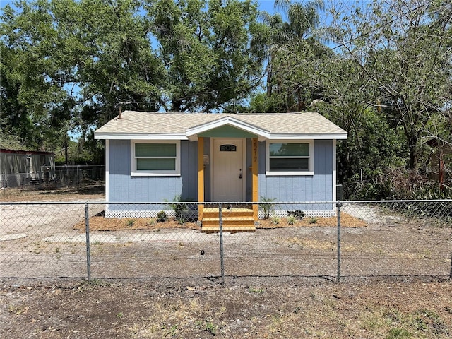 2217 Azalea Ct, Lakeland, FL 33815 - bungalow featuring a fenced front yard and a shingled roof