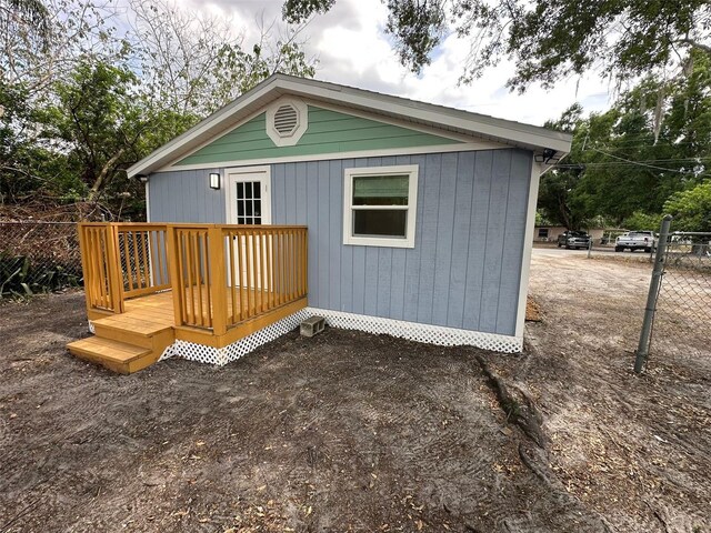 2217 Azalea Ct, Lakeland, FL 33815 - rear view of property with fence and a deck