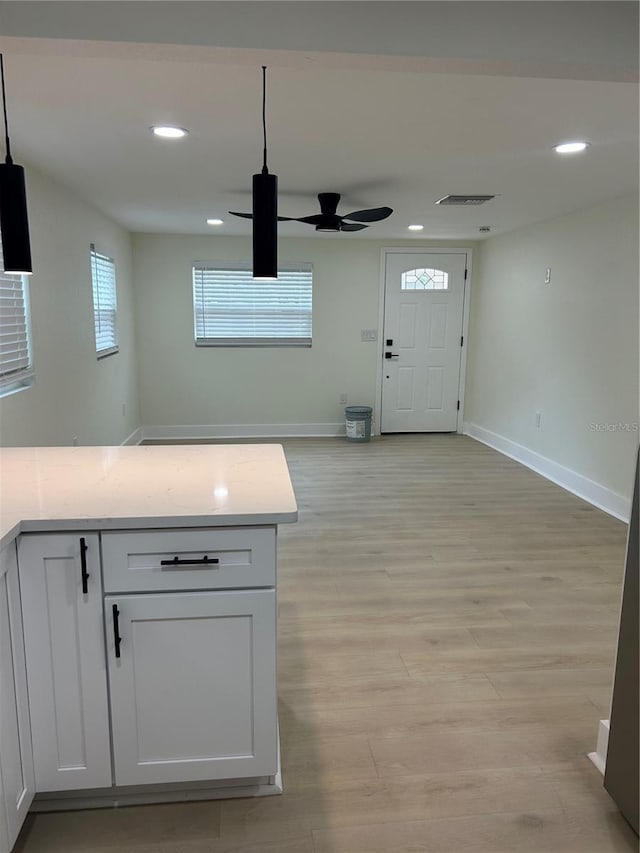 2217 Azalea Ct, Lakeland, FL 33815 - kitchen featuring a ceiling fan, recessed lighting, baseboards, light countertops, and light wood-type flooring