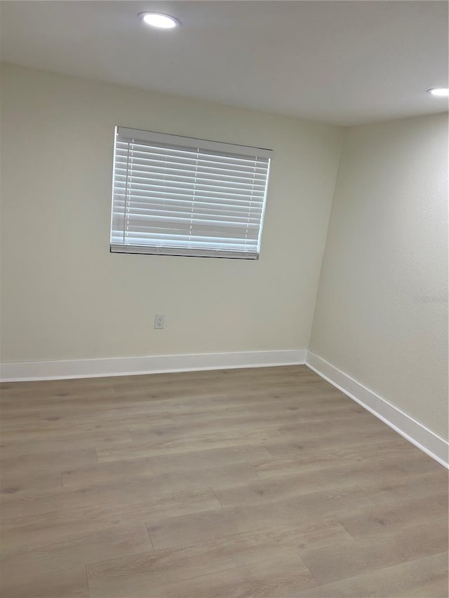 2217 Azalea Ct, Lakeland, FL 33815 - empty room featuring baseboards, light wood-style flooring, and recessed lighting