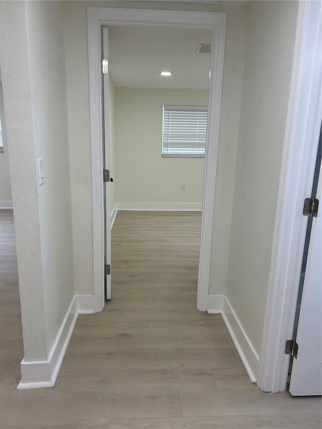 2217 Azalea Ct, Lakeland, FL 33815 - hall featuring baseboards and light wood finished floors