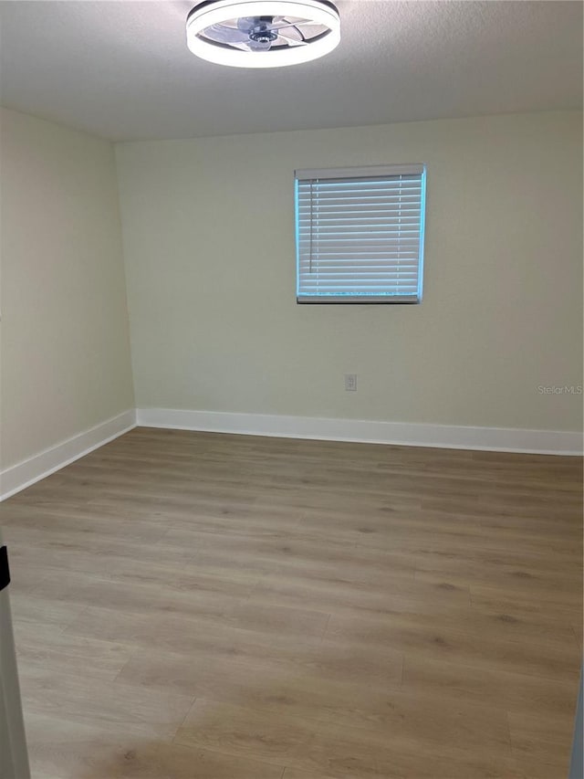 2217 Azalea Ct, Lakeland, FL 33815 - spare room featuring baseboards and light wood-style floors