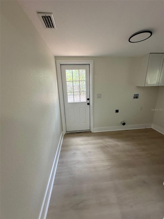 2217 Azalea Ct, Lakeland, FL 33815 - doorway with baseboards and light wood-type flooring