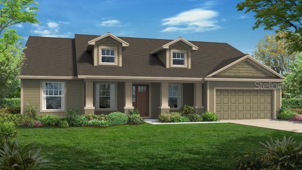 view of front of property with a front yard, an attached garage, and concrete driveway