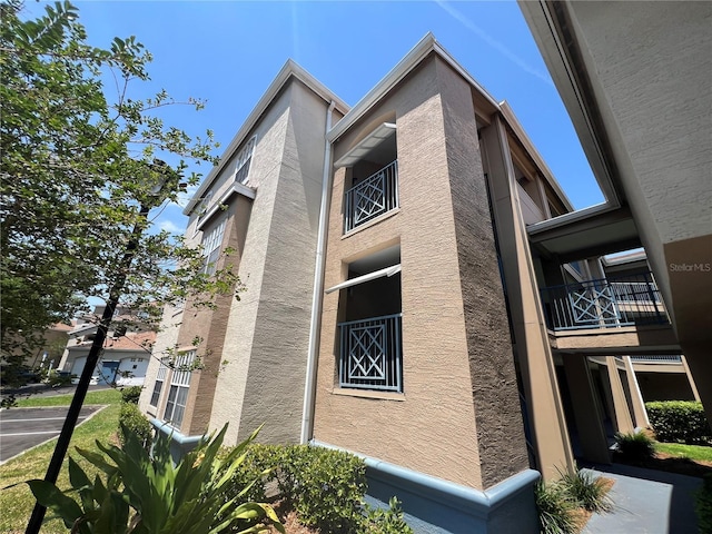 7320 Westpointe Blvd Unit 531, Orlando, FL 32835 - view of home's exterior featuring a balcony