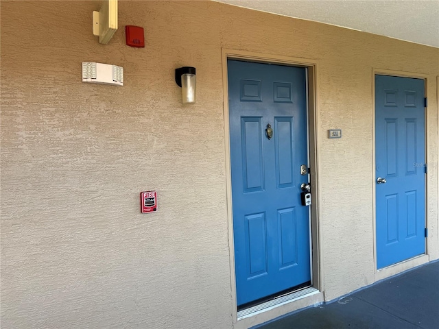 7320 Westpointe Blvd Unit 531, Orlando, FL 32835 - doorway to property with stucco siding
