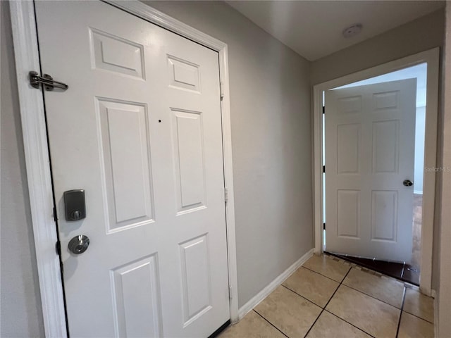 7320 Westpointe Blvd Unit 531, Orlando, FL 32835 - entryway with light tile patterned floors and baseboards