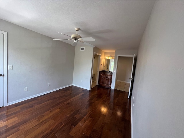 7320 Westpointe Blvd Unit 531, Orlando, FL 32835 - spare room with ceiling fan, dark wood-type flooring, and baseboards