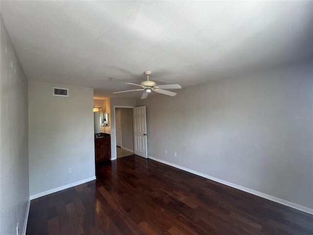 7320 Westpointe Blvd Unit 531, Orlando, FL 32835 - empty room with dark wood-style floors, ceiling fan, and baseboards