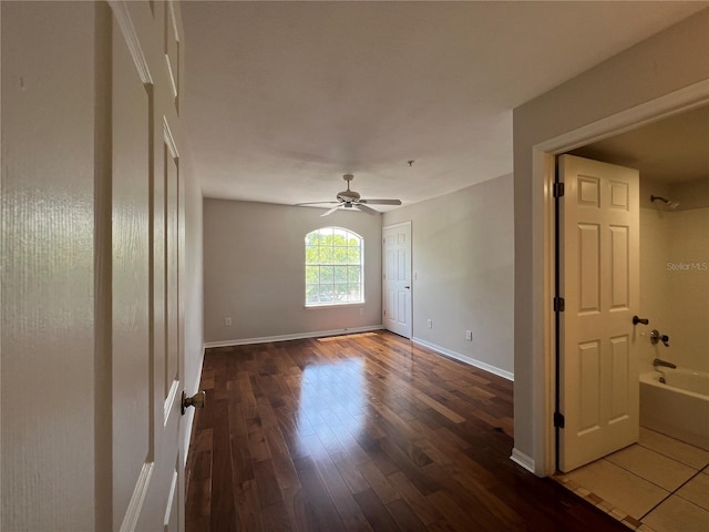 7320 Westpointe Blvd Unit 531, Orlando, FL 32835 - empty room featuring hardwood / wood-style floors, baseboards, and ceiling fan