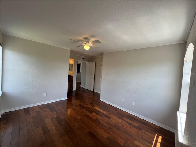 7320 Westpointe Blvd Unit 531, Orlando, FL 32835 - empty room featuring a ceiling fan, baseboards, dark wood finished floors, and crown molding