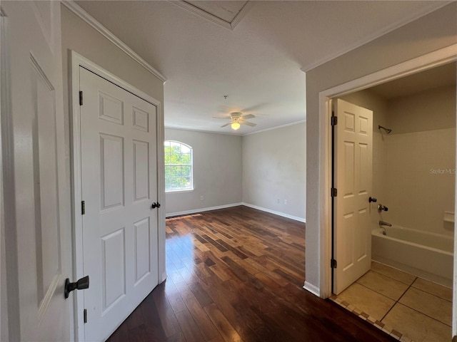 7320 Westpointe Blvd Unit 531, Orlando, FL 32835 - unfurnished room featuring ornamental molding, baseboards, dark wood finished floors, and a ceiling fan