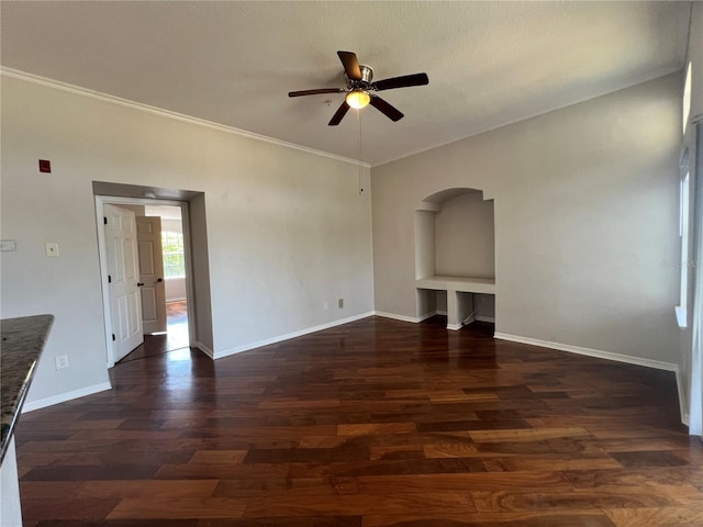 7320 Westpointe Blvd Unit 531, Orlando, FL 32835 - unfurnished living room featuring a ceiling fan, wood finished floors, arched walkways, ornamental molding, and baseboards