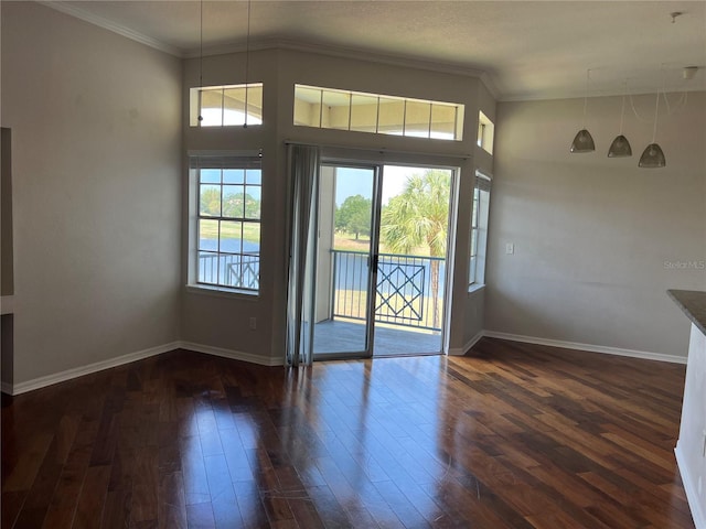 7320 Westpointe Blvd Unit 531, Orlando, FL 32835 - entryway featuring dark wood-style flooring, baseboards, and ornamental molding