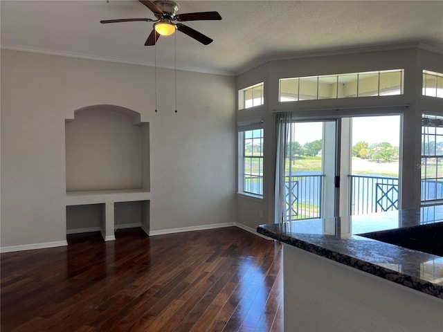 7320 Westpointe Blvd Unit 531, Orlando, FL 32835 - unfurnished living room featuring baseboards, dark wood-type flooring, ceiling fan, and ornamental molding