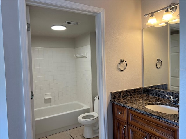 7320 Westpointe Blvd Unit 531, Orlando, FL 32835 - bathroom with tile patterned floors, vanity, toilet, and tub / shower combination
