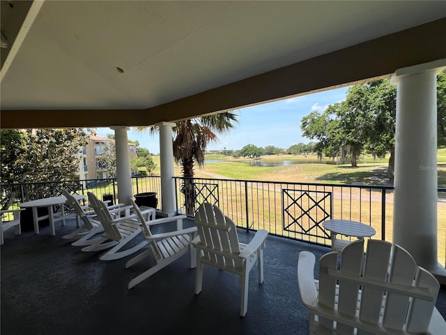 7320 Westpointe Blvd Unit 531, Orlando, FL 32835 - view of patio featuring a water view, view of golf course, and a balcony