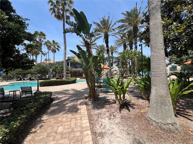 7320 Westpointe Blvd Unit 531, Orlando, FL 32835 - surrounding community featuring a swimming pool and a patio