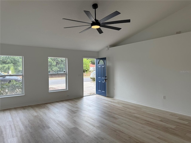 901 Cascades Park Trl, Deland, FL 32720 - unfurnished room with light wood-style flooring, ceiling fan, baseboards, and high vaulted ceiling