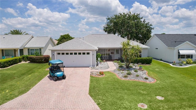 1305 Guerra Ave, The Villages, FL 32159 - single story home with decorative driveway, an attached garage, and a front lawn