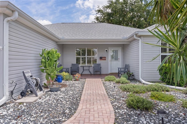 1305 Guerra Ave, The Villages, FL 32159 - view of exterior entry featuring roof with shingles and covered porch