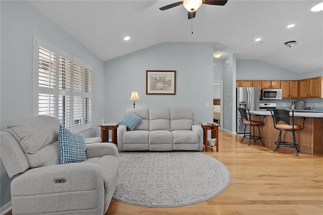 1305 Guerra Ave, The Villages, FL 32159 - living room featuring vaulted ceiling, light wood-type flooring, a ceiling fan, recessed lighting, and baseboards