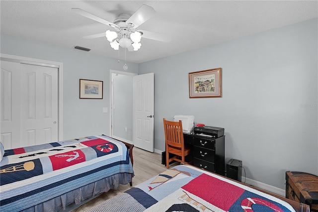 1305 Guerra Ave, The Villages, FL 32159 - bedroom featuring light wood-type flooring, baseboards, a closet, and ceiling fan