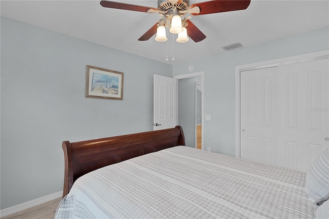 1305 Guerra Ave, The Villages, FL 32159 - bedroom with light wood-style flooring, baseboards, a closet, and a ceiling fan