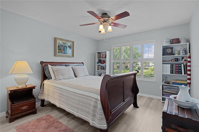 1305 Guerra Ave, The Villages, FL 32159 - bedroom featuring light wood-style floors, baseboards, and ceiling fan