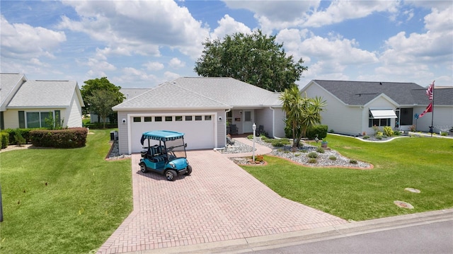 1305 Guerra Ave, The Villages, FL 32159 - ranch-style house with decorative driveway, an attached garage, and a front lawn