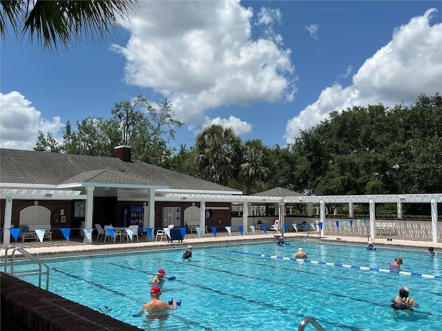 1305 Guerra Ave, The Villages, FL 32159 - community pool featuring a patio area