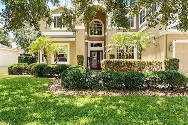 1085 Harmony Ln, Clermont, FL 34711 - view of front of home with stucco siding and a front lawn