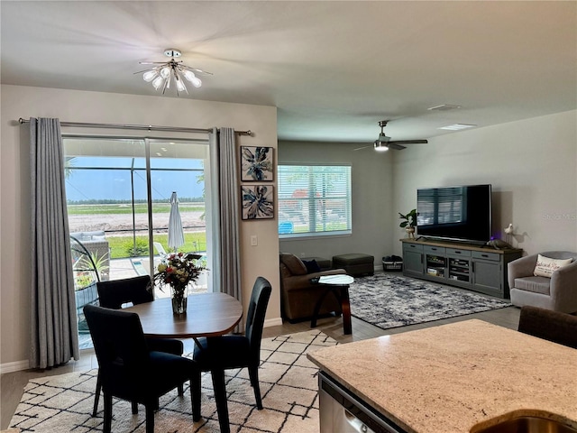 43819 Cattleman Dr, Punta Gorda, FL 33982 - dining room featuring a ceiling fan, baseboards, and light wood-type flooring