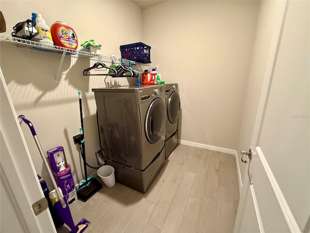 43819 Cattleman Dr, Punta Gorda, FL 33982 - washroom with independent washer and dryer, light wood-type flooring, and baseboards
