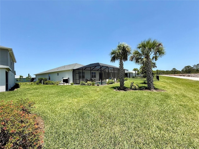 43819 Cattleman Dr, Punta Gorda, FL 33982 - view of green lawn with glass enclosure