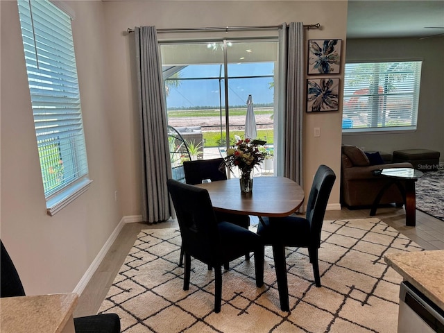 43819 Cattleman Dr, Punta Gorda, FL 33982 - dining room with baseboards and light wood-style flooring