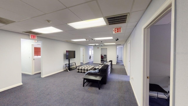 227 Central Ave, Sarasota, FL 34236 - living room with a drop ceiling, carpet flooring, and baseboards