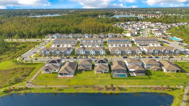 aerial perspective of suburban area with a large body of water