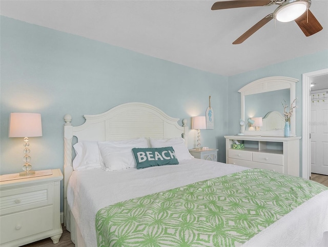 bedroom with wood finished floors and ceiling fan