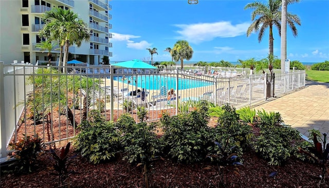 community pool featuring fence