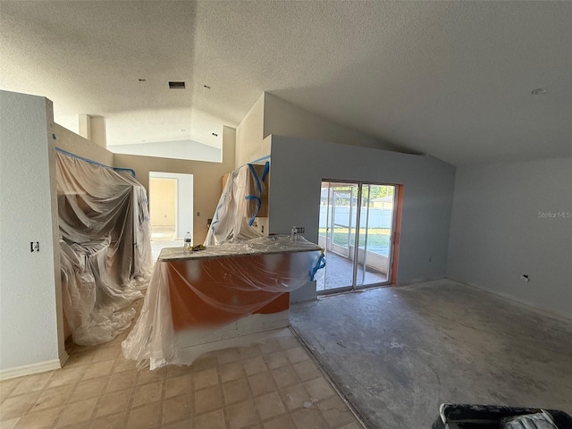 6608 Madeira Ave, Lakeland, FL 33811 - bathroom with vaulted ceiling, a textured ceiling, and baseboards