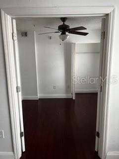 2013 Dixie Belle Dr Unit 2013K, Orlando, FL 32812 - empty room with baseboards, ceiling fan, and dark wood-style flooring