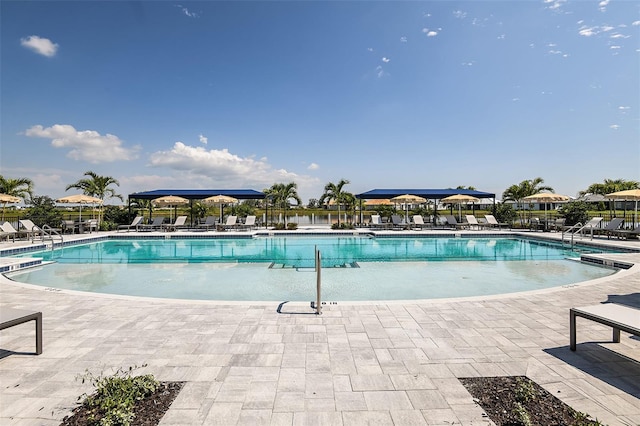 community pool featuring a patio area